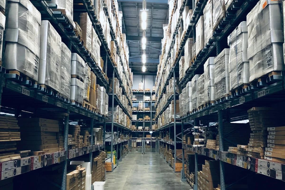 Palletized inventory cartons in a warehouse facility